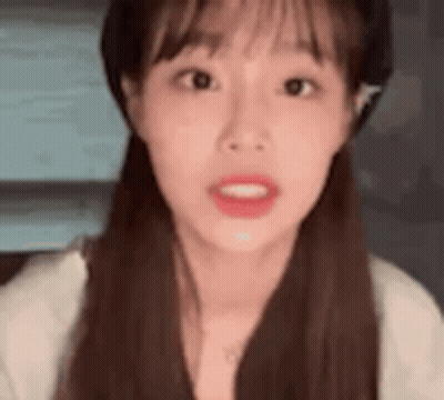 Woman In Hat And White Shirt Making Funny Face GIF