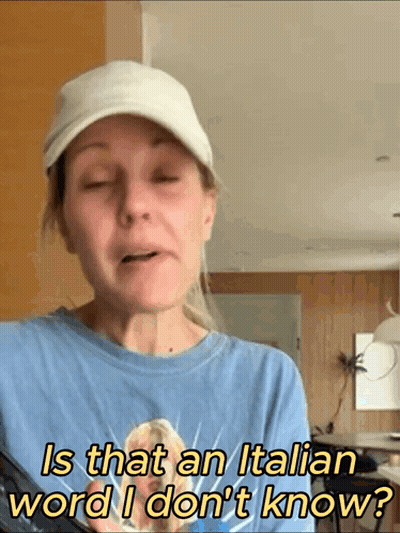 Woman In Hat Asks Is That Italian Word GIF