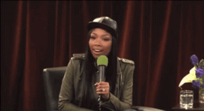 Woman In Hat Holding Microphone GIF