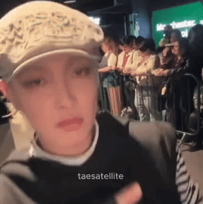 Woman In Hat In Front Of Crowd Taesatelite GIF