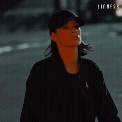Woman In Hat Saying Lioness GIF