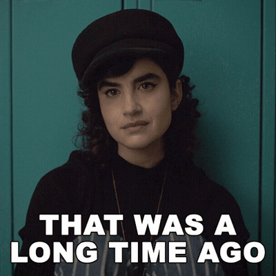 Woman In Hat Saying That Was A Long Time Ago GIF
