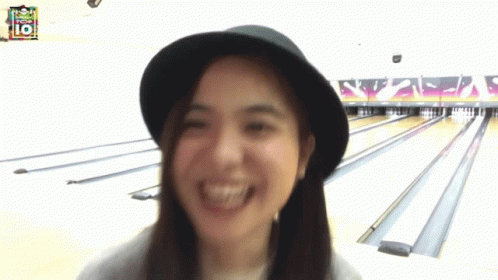 Woman In Hat Smiling At Top 10 Bowling Alley GIF