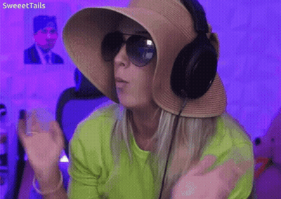 Woman In Hat Sunglasses Headphones Saying What Is Happening GIF