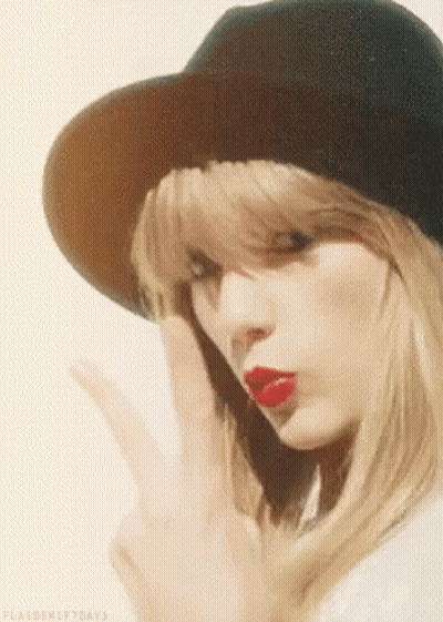 Woman In Hat With Red Lipstick Making Peace Sign GIF