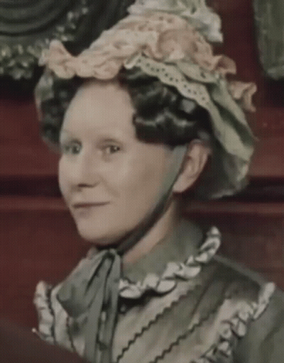 Woman In Hat With Ruffles And Bow GIF