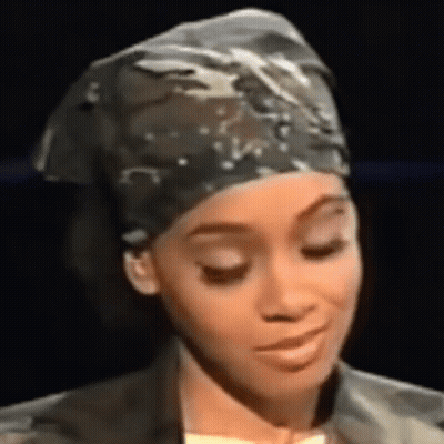 Woman In Head Scarf And Jacket Close Up GIF
