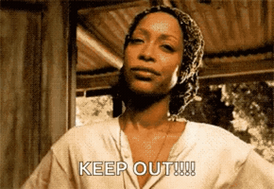 Woman In Head Scarf Says Keep Out GIF