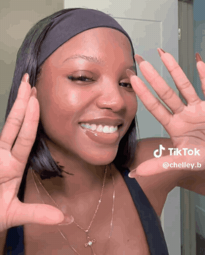 Woman In Headband And Necklace Making TikTok GIF