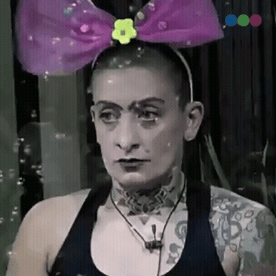 Woman In Headband With Purple Bow And Yellow Flower GIF