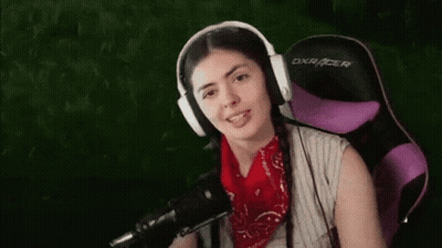 Woman In Headphones And Bandana Sitting In Purple Chair GIF