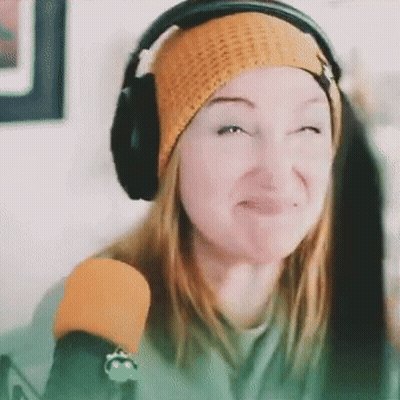 Woman In Headphones And Beanie Funny Face At Microphone GIF
