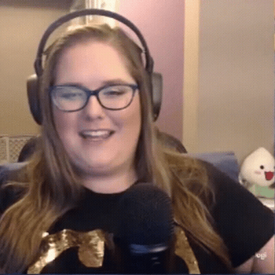 Woman In Headphones And Glasses Smiling At Microphone GIF
