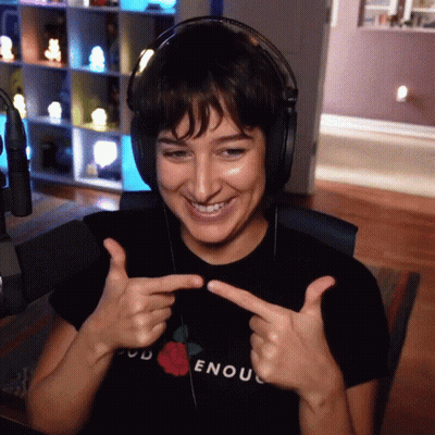 Woman in Headphones and God Enough T-Shirt