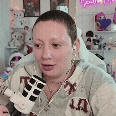 Woman In Headphones And Hoodie At Microphone GIF