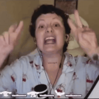 Woman In Headphones And Pajama Top Making Peace Sign GIF