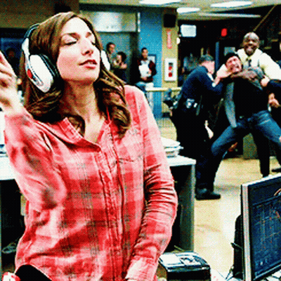Woman In Headphones And Plaid Shirt Dancing GIF