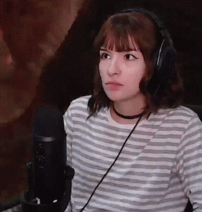 Woman In Headphones And Striped Shirt At Microphone GIF