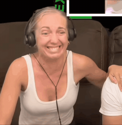 Woman In Headphones And White Tank Top Smiling In Front Of Screen Saying Ke GIF