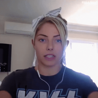 Woman In Headphones And WWE T-Shirt GIF