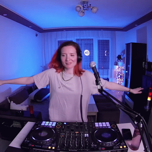 Woman In Headphones At DJ Controller GIF