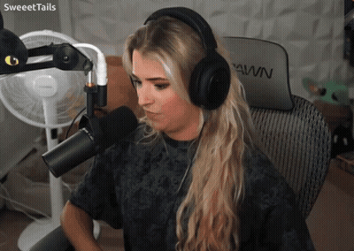 Woman In Headphones At Microphone With Pawn Chair GIF