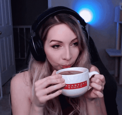Woman In Headphones Drinking Breakfast Stout Mug GIF