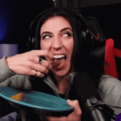 Woman in Headphones Eating From Blue Plate