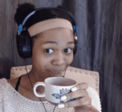 Woman In Headphones Holding Cup Of Tea GIF