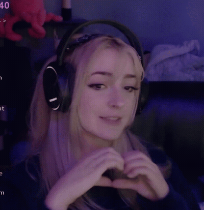 Woman In Headphones Making Heart With Hands GIF
