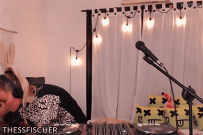 Woman in Headphones Playing DJ Set Thessfischer