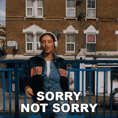 Woman In Headphones Saying Sorry Not Sorry GIF
