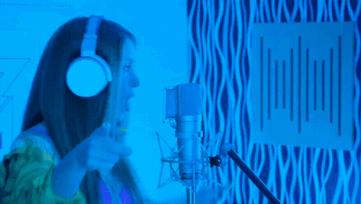 Woman In Headphones Singing Oh-Oh Into Mic GIF