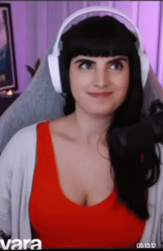 Woman In Headphones Sitting In Chair GIF