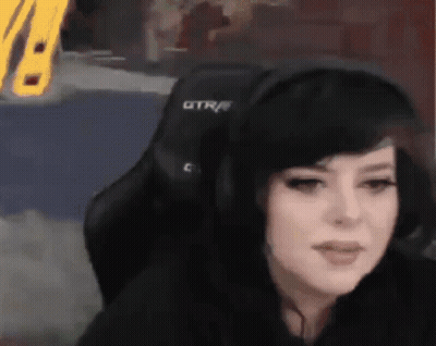 Woman In Headphones Sitting In Chair With GTR GIF