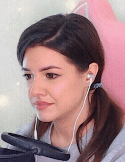 Woman In Headphones Sitting In Pink Chair GIF