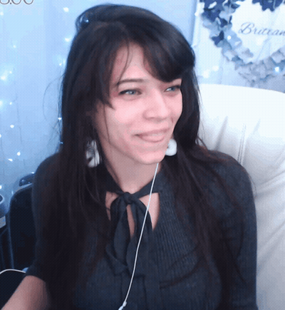 Woman In Headphones Smiling By Brasserie Wreath GIF