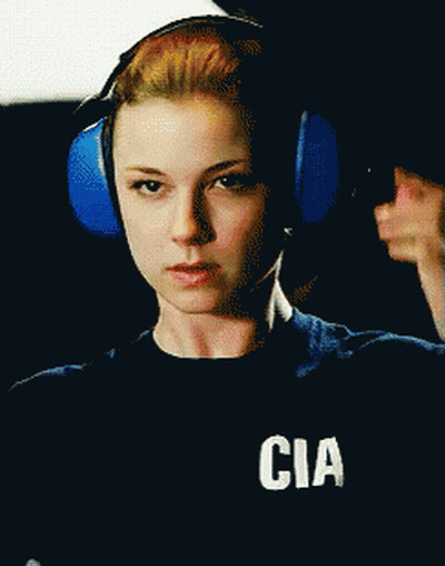 Woman In Headphones With CIA Shirt GIF
