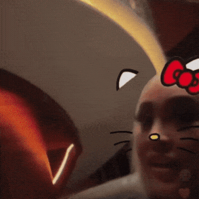 Woman In Hello Kitty Face Mask Holding Champagne GIF