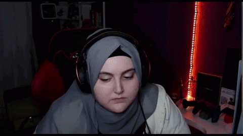 Woman In Hijab And Headphones In Xdrive Gaming Chair GIF