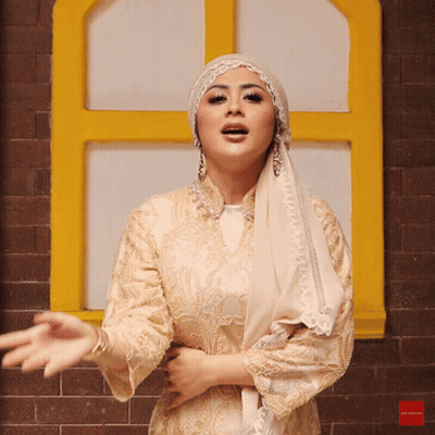 Woman In Hijab At Window GIF