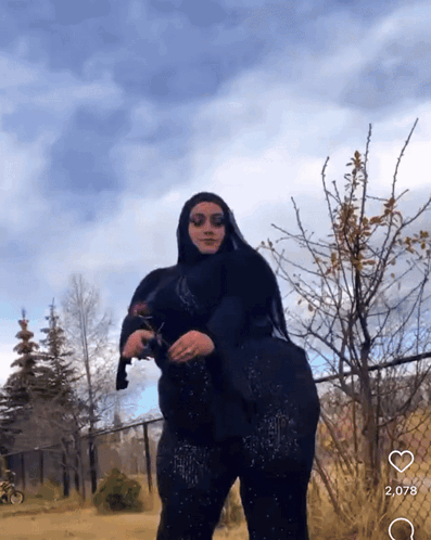 Woman In Hijab Holding Cat GIF