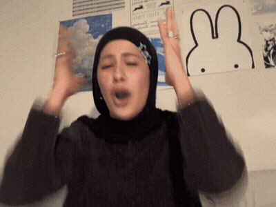 Woman In Hijab Making Funny Face Beside Rabbit Picture GIF