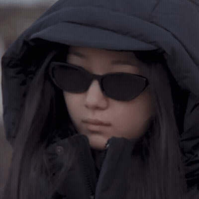 Woman In Hooded Jacket And Sunglasses GIF