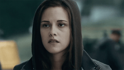 Woman In Hooded Jacket Looking At Camera GIF