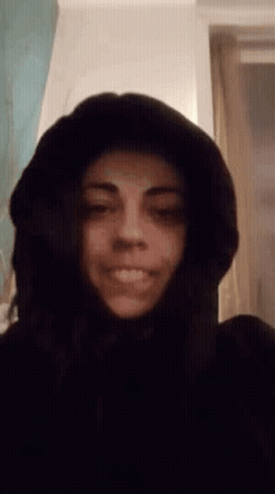 Woman In Hooded Jacket Smiling GIF