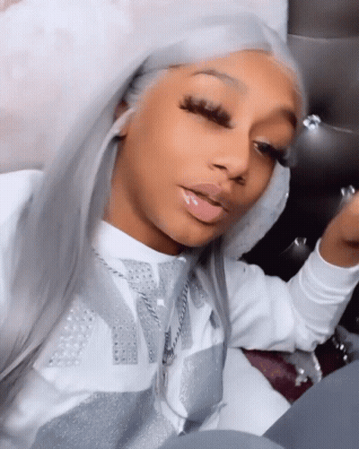 Woman In Hooded Sweater With Letter V GIF
