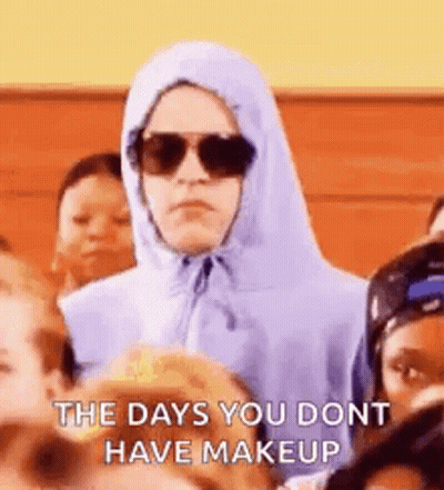 Woman In Hoodie And Sunglasses In Crowd GIF