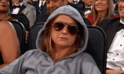 Woman In Hoodie And Sunglasses In Theater GIF