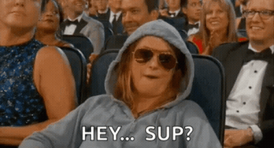 Woman in Hoodie and Sunglasses Saying Hey Sup